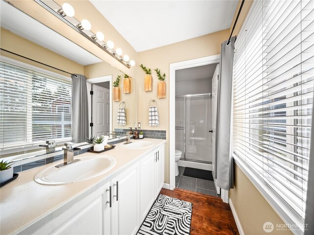 800 96th Ave NE Unit H202, Lake Stevens, WA 98258 - full bath featuring double vanity, a stall shower, and wood finished floors