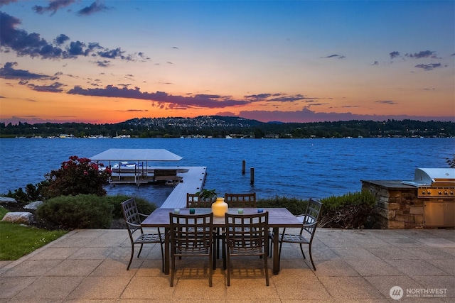 3840 E Mercer Way, Mercer Island, WA 98040 - view of patio featuring a water view, exterior kitchen, and outdoor dining area