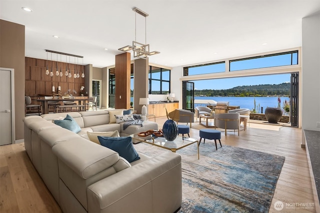 3840 E Mercer Way, Mercer Island, WA 98040 - living room featuring healthy amount of natural light, wood finished floors, a chandelier, and recessed lighting
