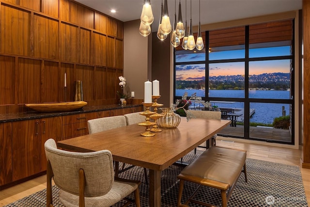3840 E Mercer Way, Mercer Island, WA 98040 - dining room with light wood-type flooring, a chandelier, and a water view