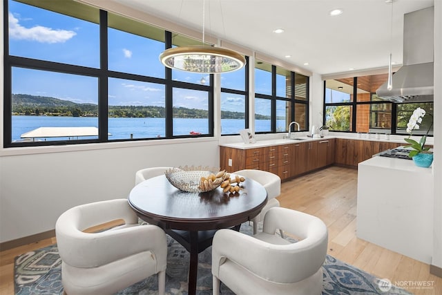 3840 E Mercer Way, Mercer Island, WA 98040 - dining space with light wood-style floors, recessed lighting, and a water view