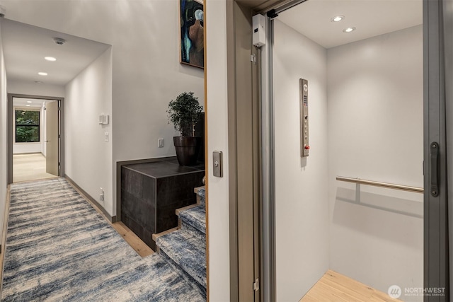 3840 E Mercer Way, Mercer Island, WA 98040 - hallway with elevator, wood finished floors, recessed lighting, and stairway