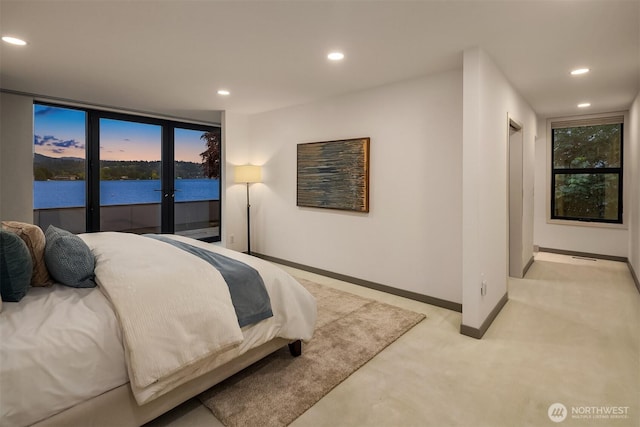 3840 E Mercer Way, Mercer Island, WA 98040 - bedroom with light colored carpet, recessed lighting, access to exterior, a water view, and french doors
