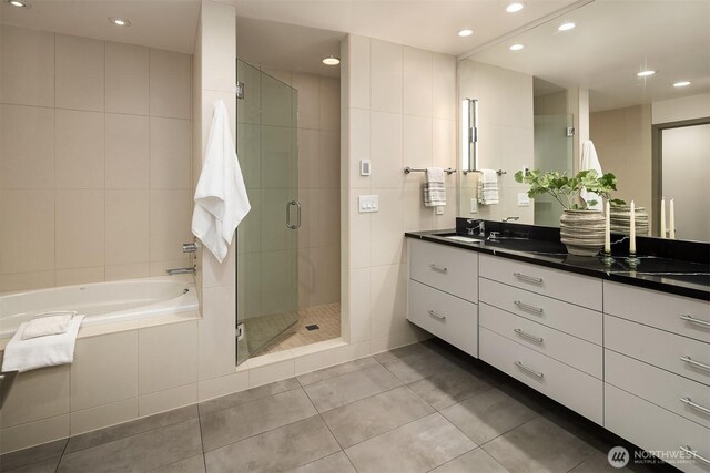 3840 E Mercer Way, Mercer Island, WA 98040 - full bathroom featuring tile walls, tile patterned floors, a shower stall, a garden tub, and double vanity