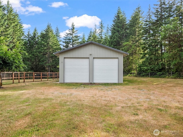 101 E Carols Pl, Belfair, WA 98528 - detached garage featuring a view of trees