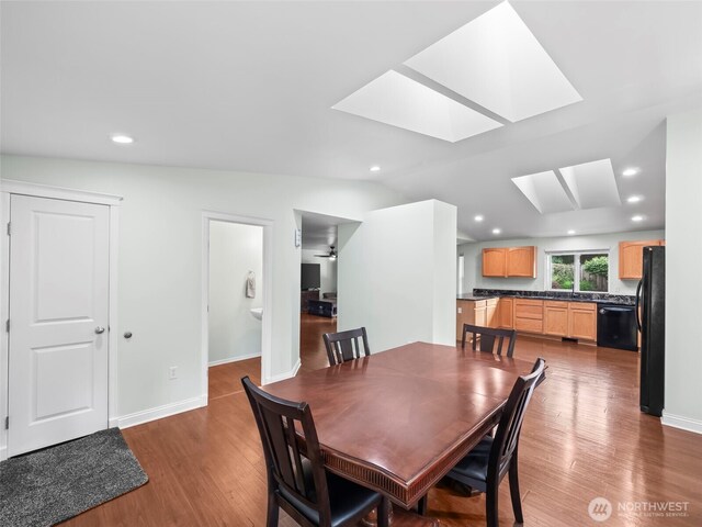 101 E Carols Pl, Belfair, WA 98528 - dining area with a skylight, wood finished floors, recessed lighting, and lofted ceiling