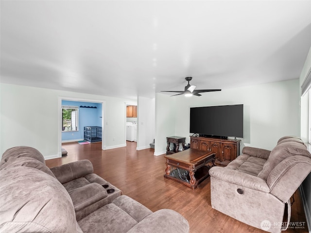 101 E Carols Pl, Belfair, WA 98528 - living room featuring wood finished floors, a ceiling fan, and washer / dryer