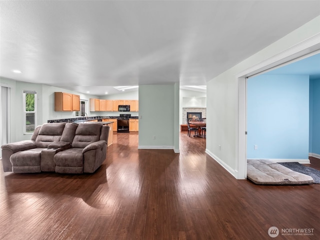 101 E Carols Pl, Belfair, WA 98528 - living room with dark wood-type flooring, a fireplace, and recessed lighting