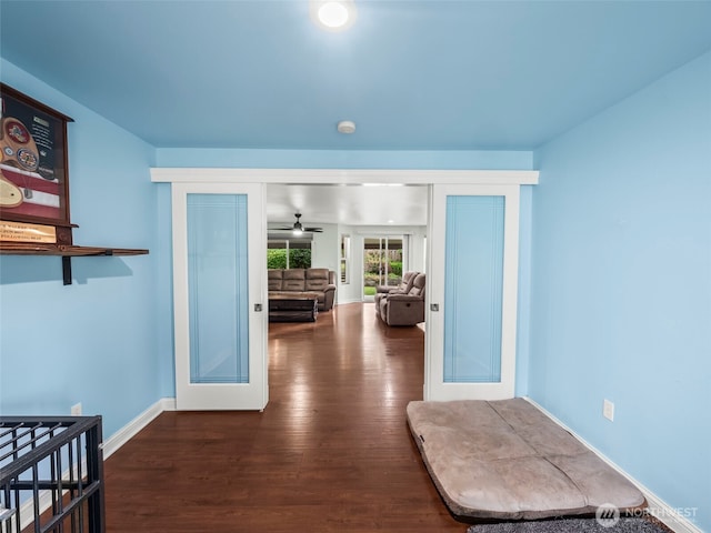 101 E Carols Pl, Belfair, WA 98528 - corridor with dark wood-style flooring and baseboards