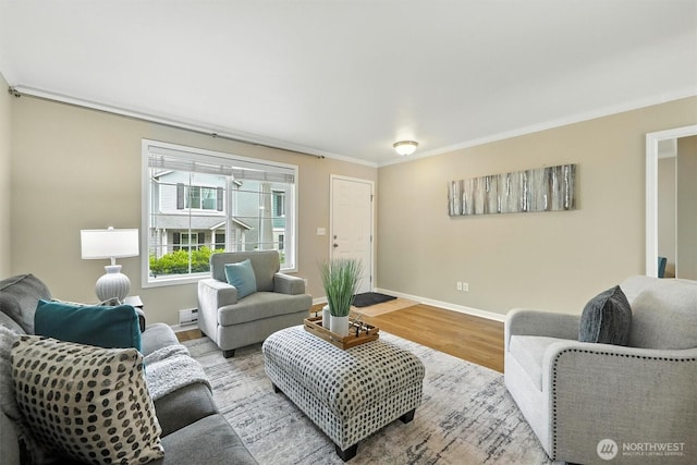 9414 Hancock Ave SE, Snoqualmie, WA 98065 - living room with wood finished floors, baseboard heating, and crown molding