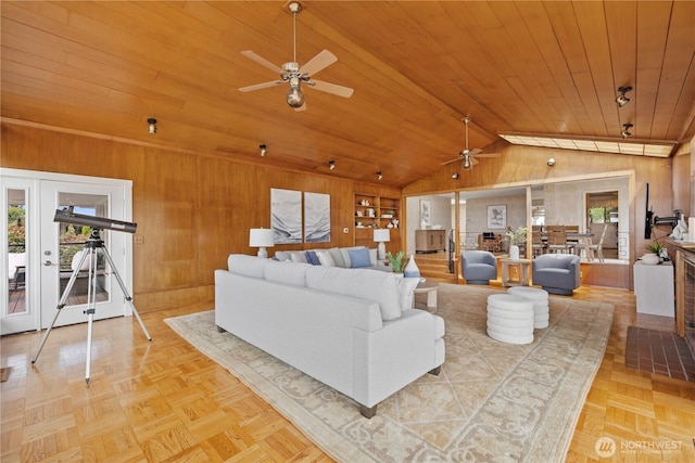 18035 8th Ave NW, Shoreline, WA 98177 - living area featuring a ceiling fan, wood walls, lofted ceiling, wood ceiling, and french doors