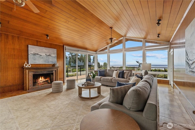 18035 8th Ave NW, Shoreline, WA 98177 - living room with ceiling fan, vaulted ceiling, healthy amount of natural light, wooden ceiling, and a fireplace