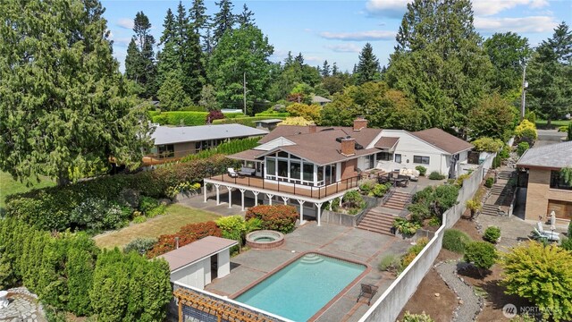 18035 8th Ave NW, Shoreline, WA 98177 - back of house featuring stairway, an in-ground hot tub, an outdoor pool, a patio area, and a deck