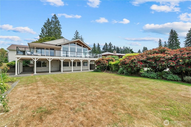 18035 8th Ave NW, Shoreline, WA 98177 - rear view of property with a lawn and a patio