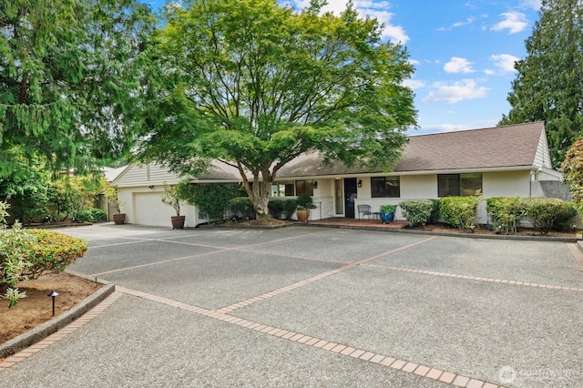 18035 8th Ave NW, Shoreline, WA 98177 - ranch-style home featuring an attached garage, stucco siding, and a shingled roof