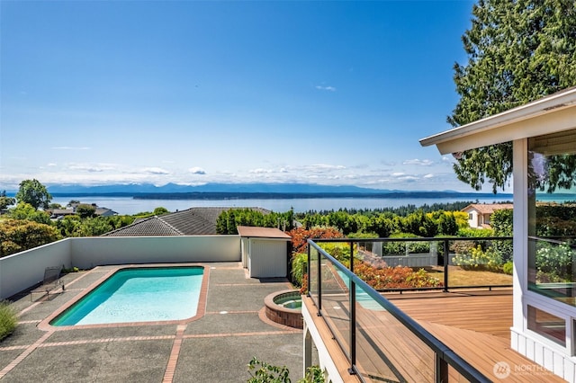 18035 8th Ave NW, Shoreline, WA 98177 - view of swimming pool with an in-ground hot tub, a fenced backyard, a deck with water view, and a patio
