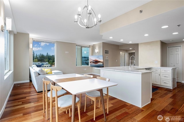 177 107th Ave NE Unit 1012, Bellevue, WA 98004 - dining area with wood finished floors, a chandelier, and recessed lighting