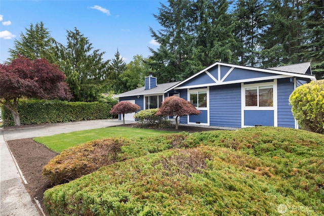 828 116th St SW, Everett, WA 98204 - single story home with a chimney, driveway, and a garage