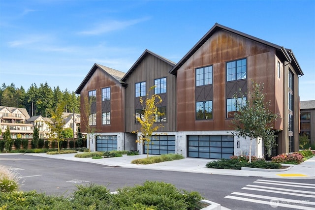 4566 Flying Goat Ave NE Unit C220, Bainbridge Island, WA 98110 - view of building exterior featuring a garage and driveway