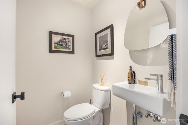4566 Flying Goat Ave NE Unit C220, Bainbridge Island, WA 98110 - half bathroom featuring toilet and baseboards