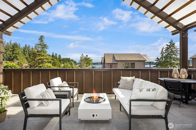 4566 Flying Goat Ave NE Unit C220, Bainbridge Island, WA 98110 - view of patio / terrace with an outdoor living space with a fire pit and a pergola