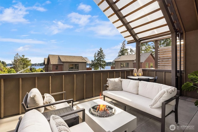 4566 Flying Goat Ave NE Unit C220, Bainbridge Island, WA 98110 - view of patio / terrace featuring an outdoor living space with a fire pit and a pergola