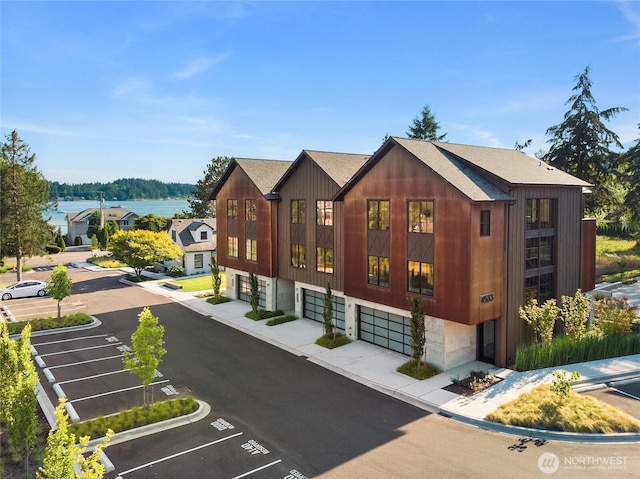 4566 Flying Goat Ave NE Unit C220, Bainbridge Island, WA 98110 - view of property with uncovered parking and an attached garage