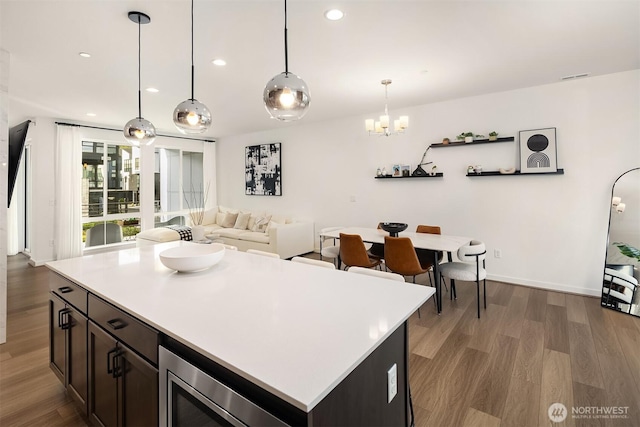 21822 25th Ave SE Unit B, Bothell, WA 98021 - kitchen featuring wood finished floors, a chandelier, recessed lighting, light countertops, and decorative light fixtures