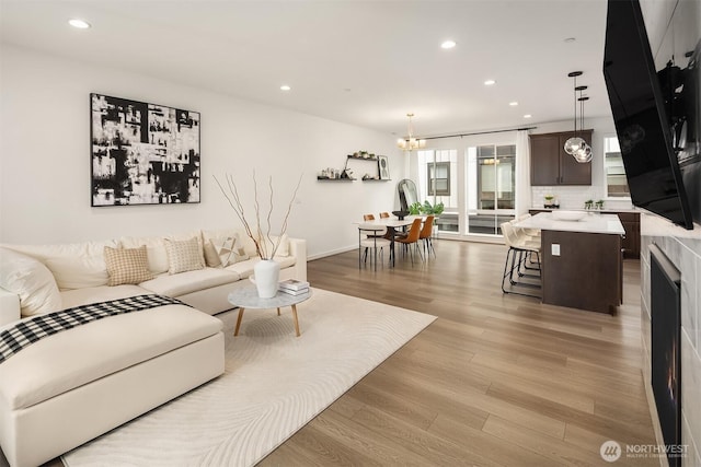 21822 25th Ave SE Unit B, Bothell, WA 98021 - living area with light wood-style floors, recessed lighting, and a chandelier