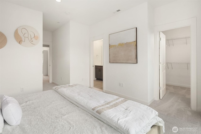 21822 25th Ave SE Unit B, Bothell, WA 98021 - bedroom featuring light colored carpet, a walk in closet, a closet, and connected bathroom