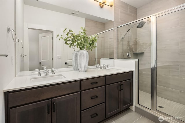 21822 25th Ave SE Unit B, Bothell, WA 98021 - bathroom with double vanity, a shower stall, and tile patterned flooring