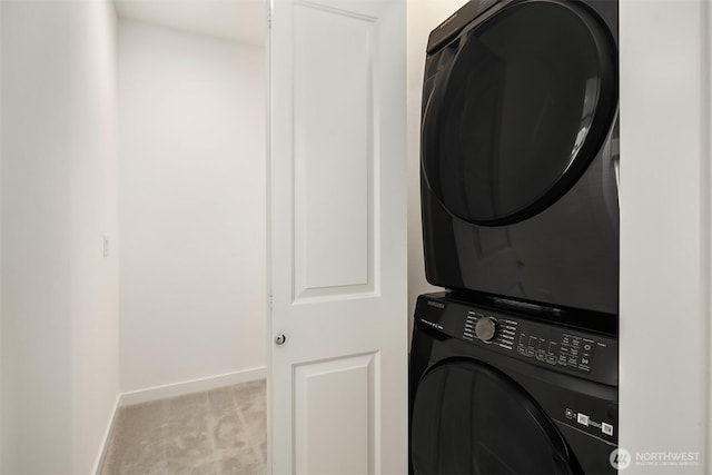 21822 25th Ave SE Unit B, Bothell, WA 98021 - laundry room featuring stacked washer and clothes dryer and carpet floors