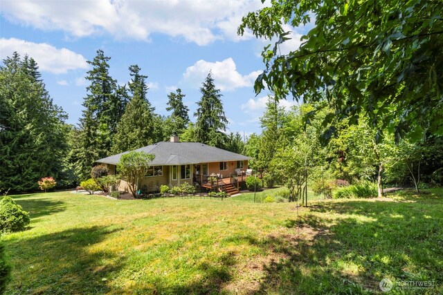 1852 NW Lutes Rd, Poulsbo, WA 98370 - view of green lawn with a deck
