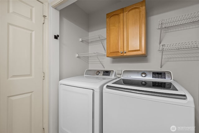 16907 Lookout Mountain Rd SE, Monroe, WA 98272 - washroom with cabinet space and washer and clothes dryer