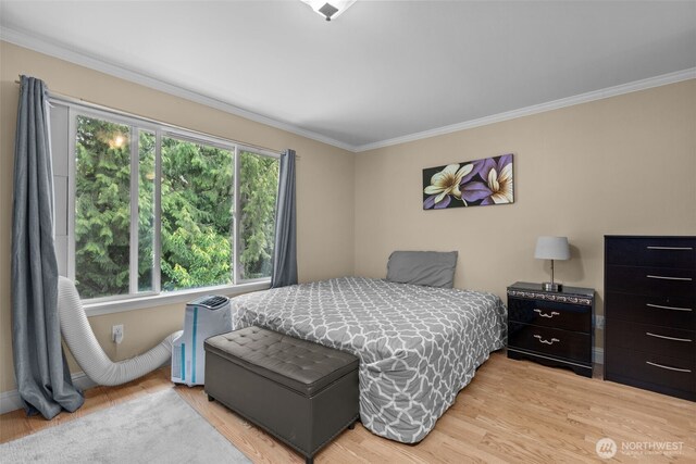 16907 Lookout Mountain Rd SE, Monroe, WA 98272 - bedroom with ornamental molding and light wood-style floors