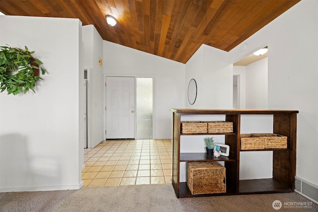 606 N State St, Bellingham, WA 98225 - carpeted entrance foyer featuring wooden ceiling, tile patterned floors, and vaulted ceiling
