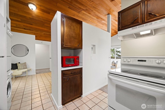 606 N State St, Bellingham, WA 98225 - kitchen featuring white range with electric cooktop, wooden ceiling, under cabinet range hood, light tile patterned floors, and light countertops