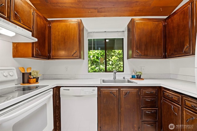606 N State St, Bellingham, WA 98225 - kitchen with white appliances, under cabinet range hood, light countertops, and wood ceiling