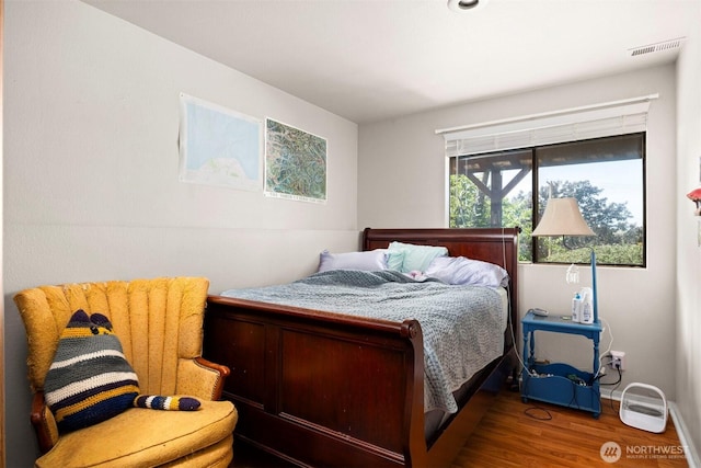 606 N State St, Bellingham, WA 98225 - bedroom featuring wood finished floors and baseboards