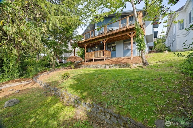 606 N State St, Bellingham, WA 98225 - rear view of property featuring a yard and a wooden deck