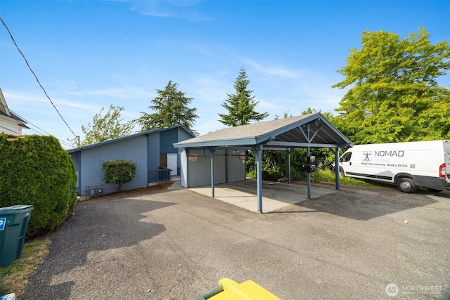 606 N State St, Bellingham, WA 98225 - view of front of house featuring a detached carport and asphalt driveway