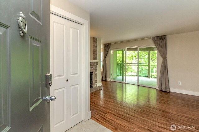 3008 N Narrows Dr Unit B102, Tacoma, WA 98407 - foyer with light wood-style floors and a fireplace