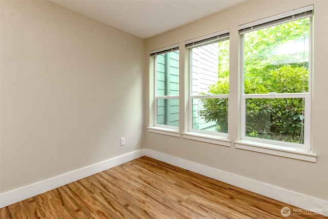 3008 N Narrows Dr Unit B102, Tacoma, WA 98407 - spare room featuring healthy amount of natural light and light wood finished floors