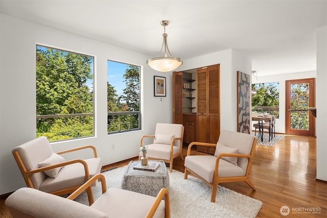 5665 E Mercer Way, Mercer Island, WA 98040 - living area featuring healthy amount of natural light and wood finished floors