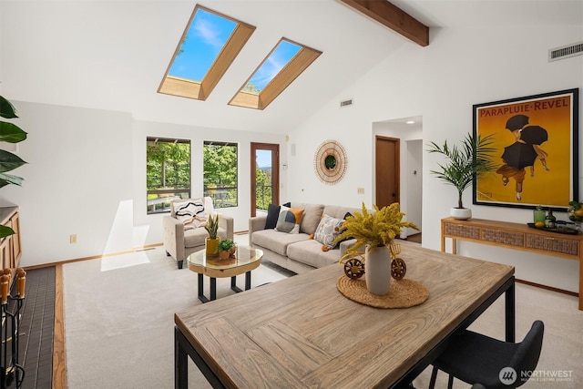 5665 E Mercer Way, Mercer Island, WA 98040 - dining area with a skylight, carpet flooring, beamed ceiling, and high vaulted ceiling