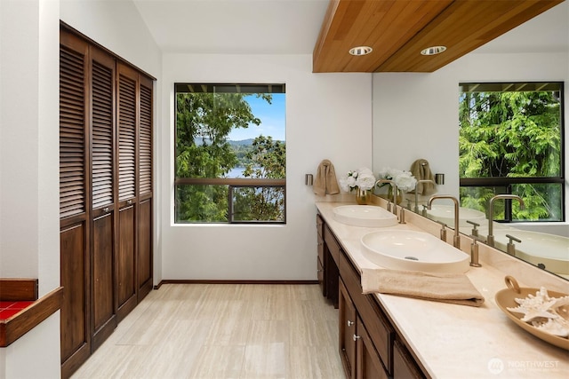 5665 E Mercer Way, Mercer Island, WA 98040 - bathroom with healthy amount of natural light, double vanity, and a closet