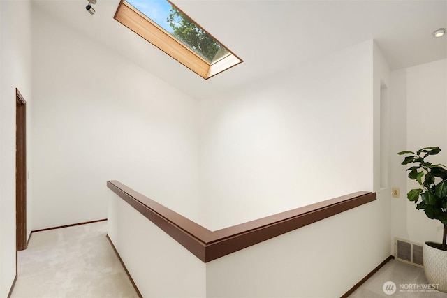 5665 E Mercer Way, Mercer Island, WA 98040 - hallway with a skylight and light carpet