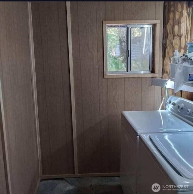 118 Pyramid Pl, Ashford, WA 98304 - washroom featuring separate washer and dryer and wooden walls