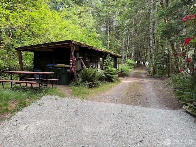 118 Pyramid Pl, Ashford, WA 98304 - view of property exterior featuring a forest view and an outbuilding