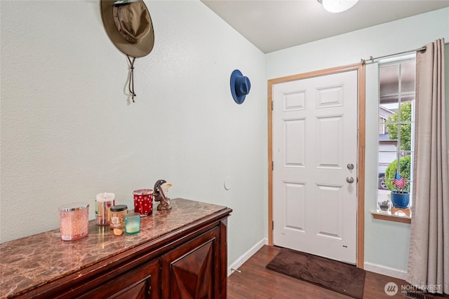 17707 1st Avenue Ct E, Spanaway, WA 98387 - foyer entrance featuring dark wood-style floors and baseboards